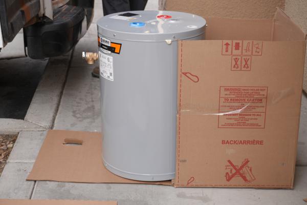 Plumber checking water heater