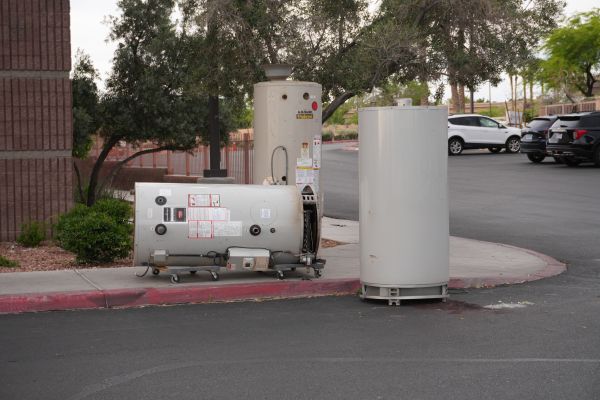 Royalty Plumbing technician performing water heater repair in Las Vegas