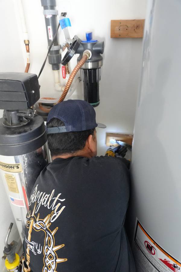 Whole-house filter housing with failed O-ring leaking in Las Vegas garage installation
