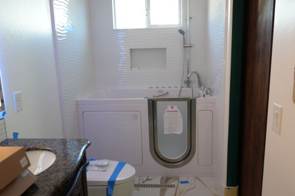 A professional plumber from Royalty Plumbing providing residential kitchen plumbing services.