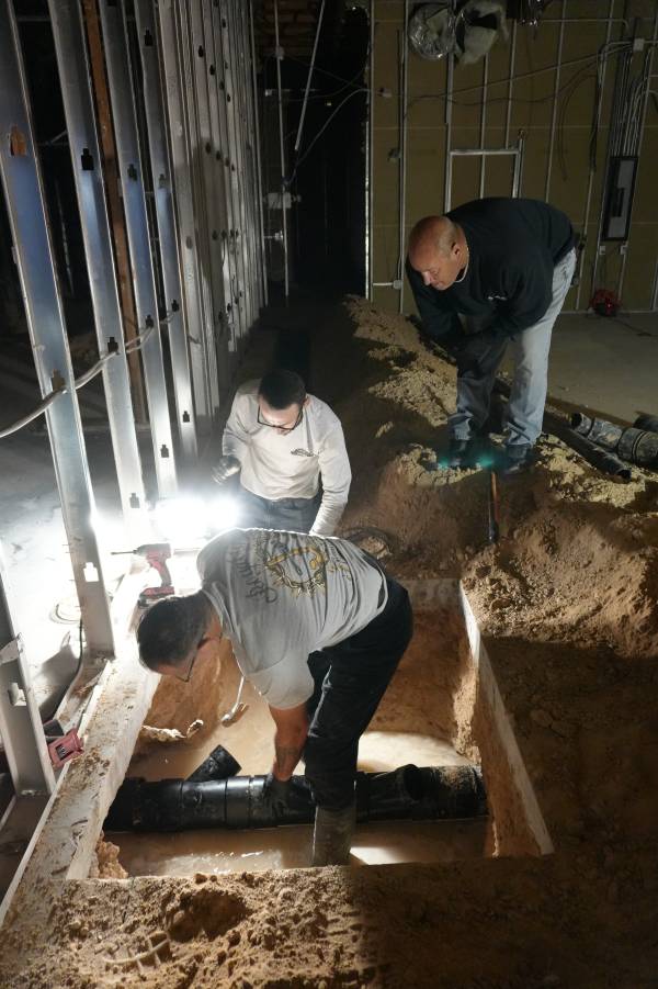 Royalty Plumbing plumber reviewing sewer line repair access point in Las Vegas