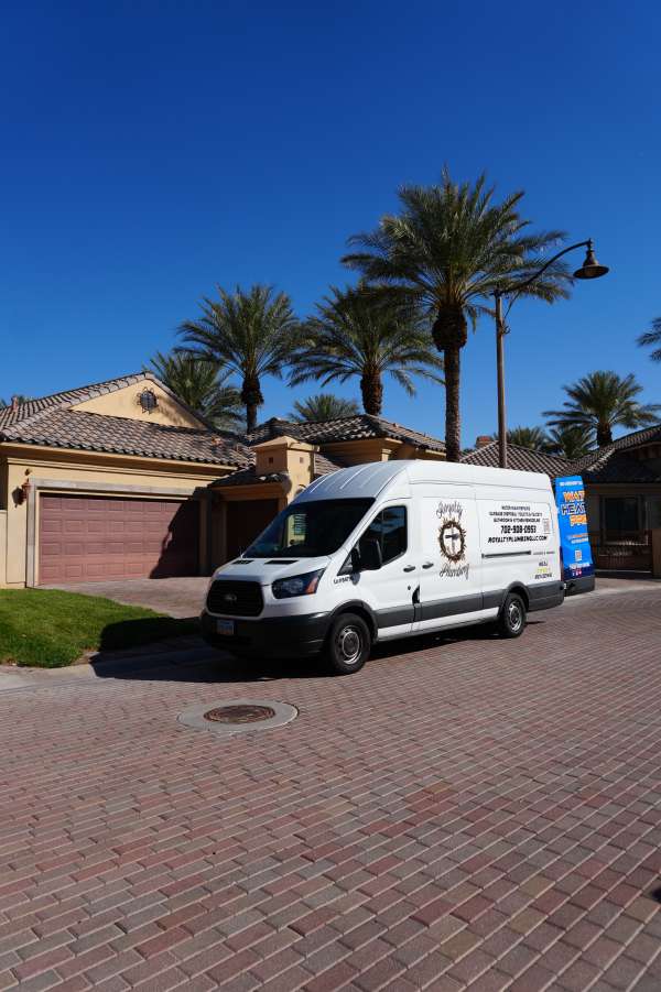 Royalty Plumbing technician diagnosing a leaking sink p-trap in a Las Vegas home