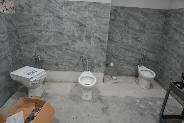 A professional plumber from Royalty Plumbing providing residential kitchen plumbing services.