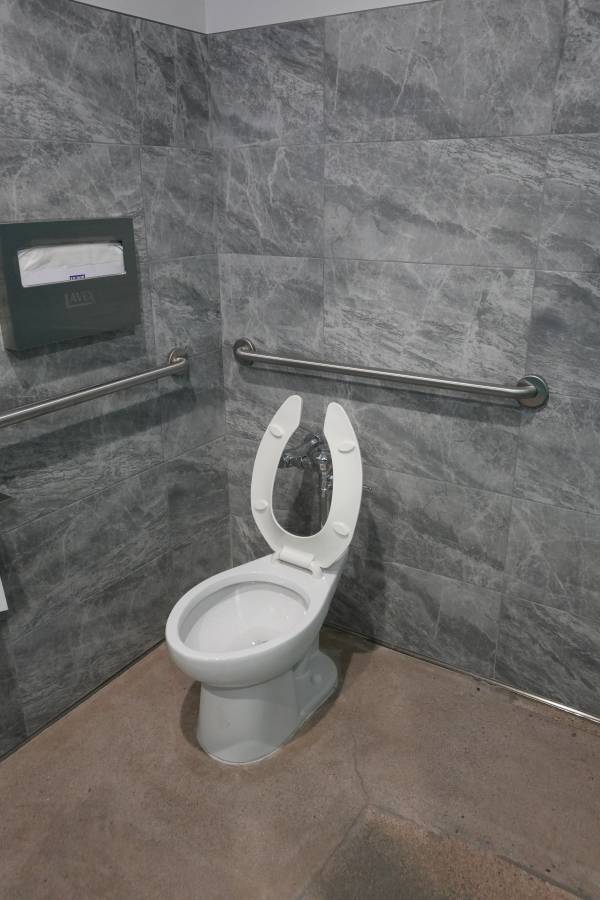 Royalty Plumbing plumber inspecting toilet flange during wax ring replacement in Las Vegas