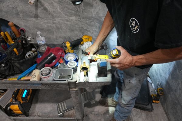 A professional plumber from Royalty Plumbing providing residential kitchen plumbing services.