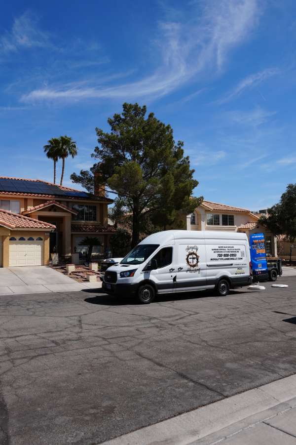 Royalty Plumbing technician diagnosing a leaking sink p-trap in a Las Vegas home